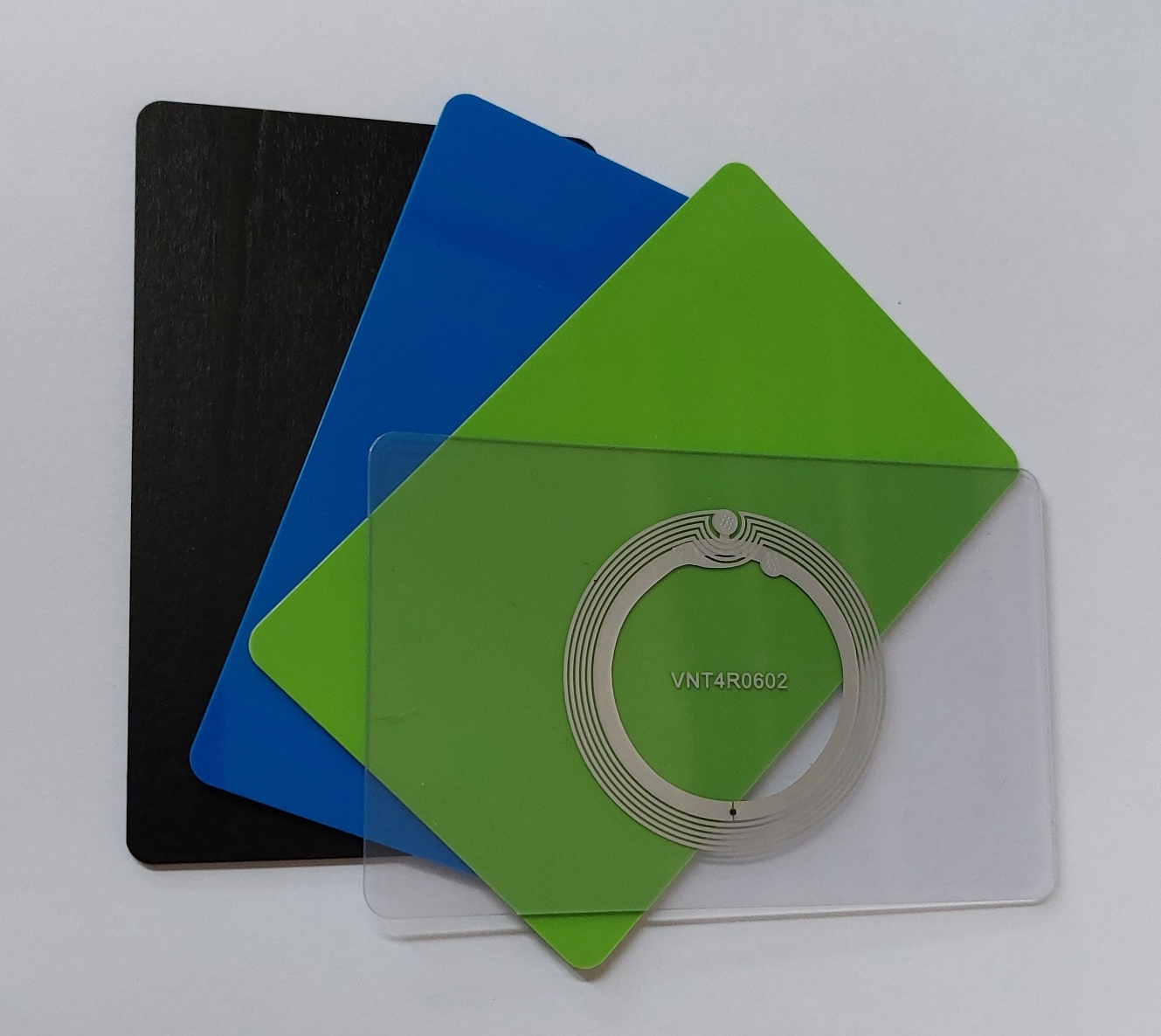 NFC Cards in black wood, blue, green and clear PVC